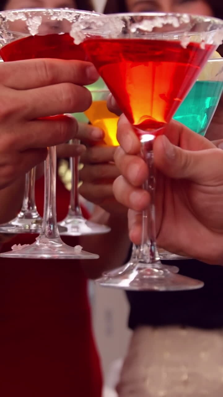Group of friends toasting with cocktail