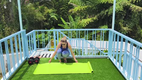 woman working out on rooftop patio