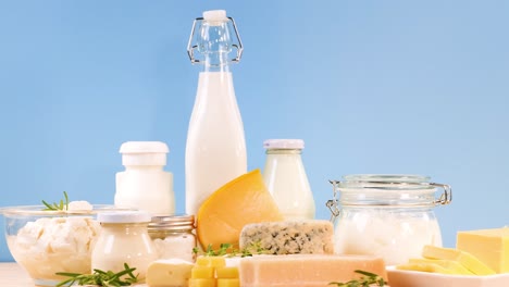 assorted dairy items displayed against blue backdrop