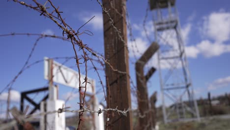 Barbed-wife-fence-and-guard-tower-at-a-high-security-prison