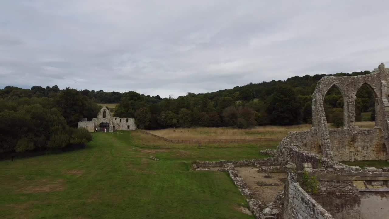 Sweeping drone shot from the historic ruins of Bayham Old Abbey to the picturesque Abbey Arches, nestled in the English countryside. A journey through time and nature's beauty