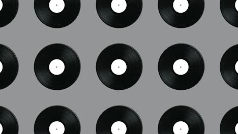 geometric pattern with retro vinyl disks on a gray background. minimal motion graphics music animation concept