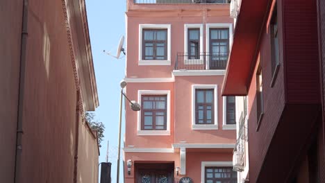 charming narrow alleyway with pastel-colored buildings