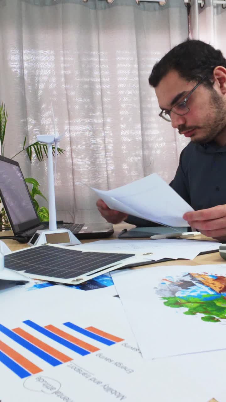 Scientist Reviewing Environmental Data and Project Documents