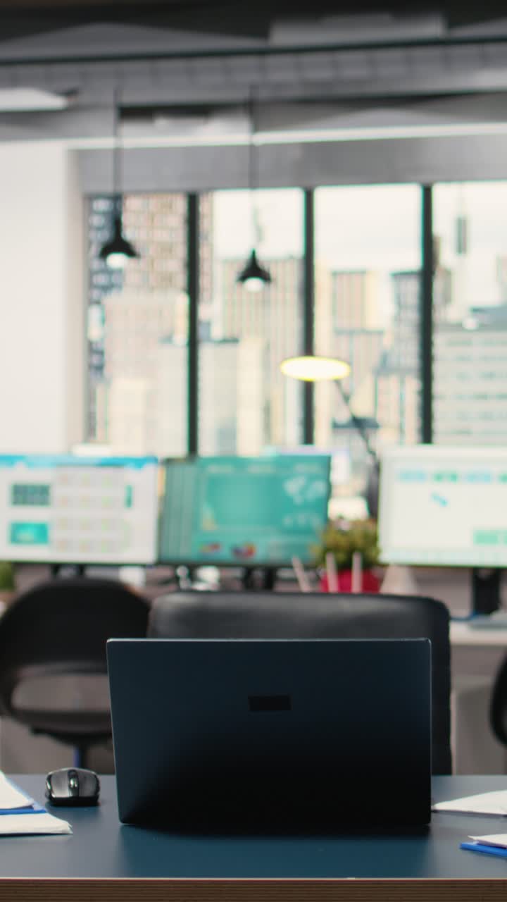 Vertical Video Modern business desk in empty office showcases workspace prepared for analytics