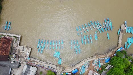 Overhead-drone-view-of-harbour-with-full-of-traditional-fisherman-boats---Baron-Beach,-Indonesia