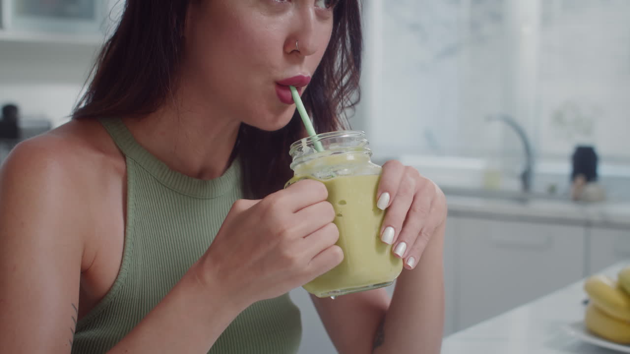 Caucasian Woman Drinking Smoothie for Breakfast