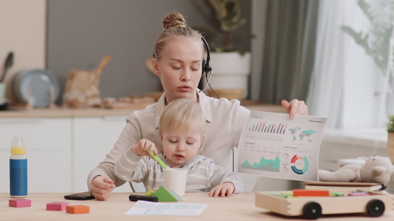 Woman Working and Feeding Child