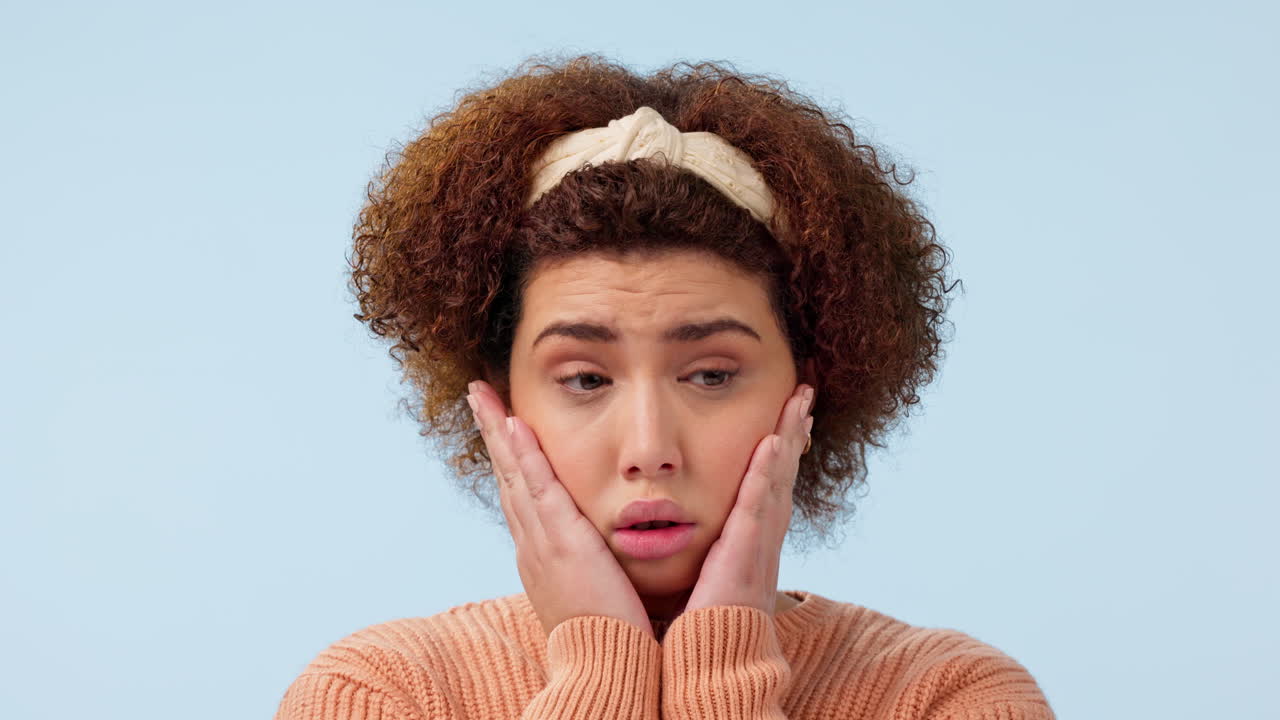 Anxiety, face and woman biting nails in studio