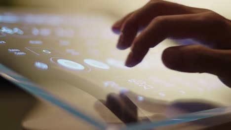 person interacting with a futuristic transparent touchscreen display
