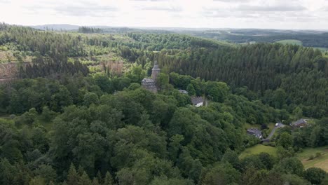 wide circular drone shot of wildenburg castle in the southeast of the village of friesenhagen, in the north rhine-westphalia region of germany