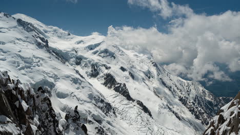 Time-Lapse,-Sunny-Winter-Day-in-French-Alps,-Clouds-Moving-Above-Mont-Blanc-and-Chamonix