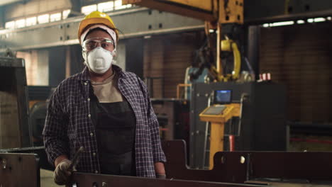 worker sanding down the plank