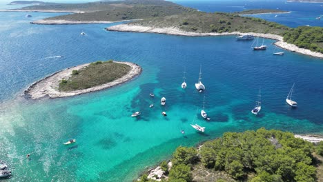 aerial view of paklinski islands off the coast of hvar, croatia, with clear blue waters and boats anchored nearby