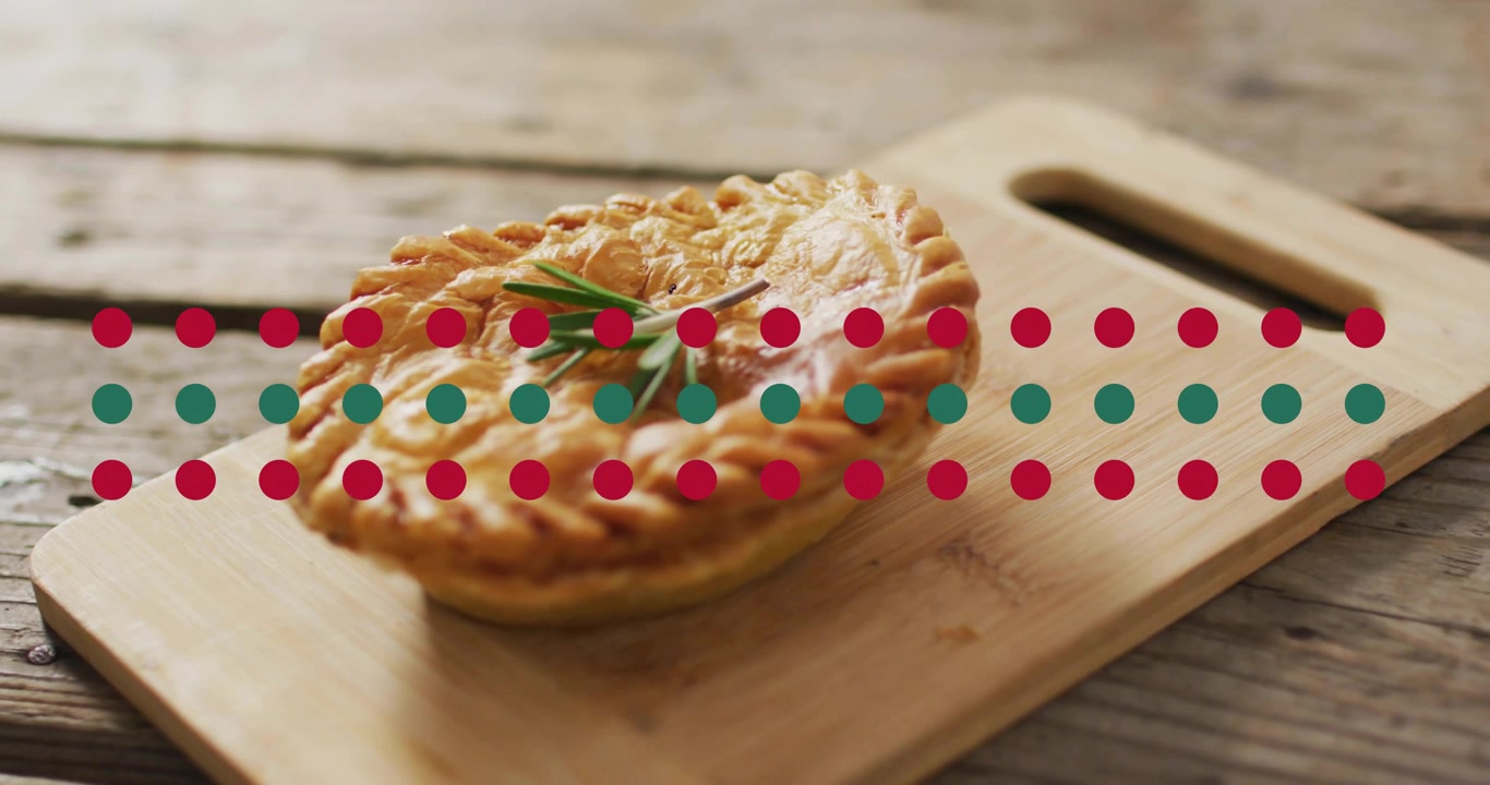 Shot starting, camera pushing right while focus tightening on hand pie to highlight rosemary sprig