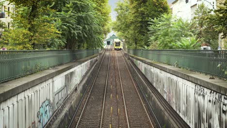 modern underground train of berlin driving out of tunnel into daylight