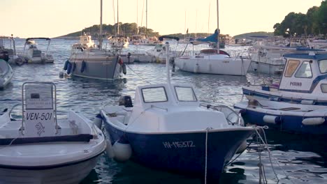 Slomo-Docked-Boats-Swaying-in-the-Water-at-Sunset