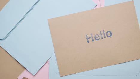 Close-up-of-hello-text-in-blue--on-a-envelope