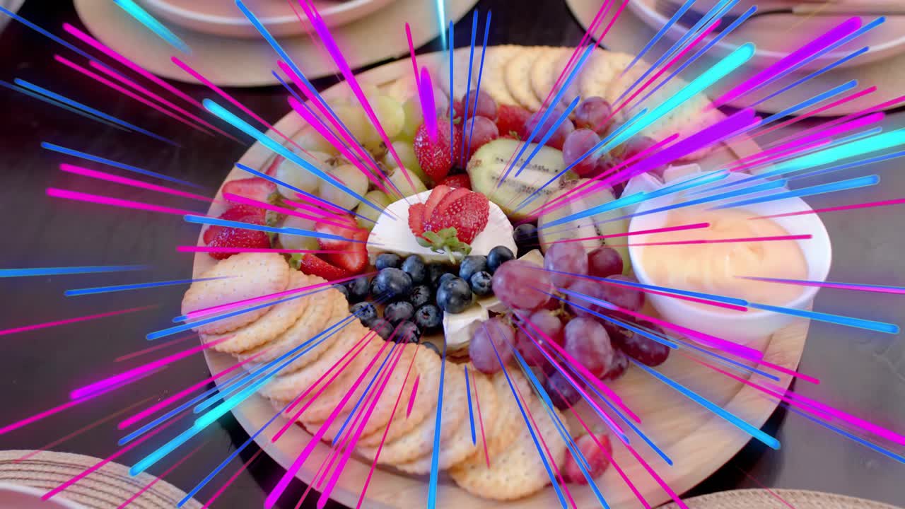 Wooden board with crackers, fruit, neon streaks bursting from center, camera centering to showcase