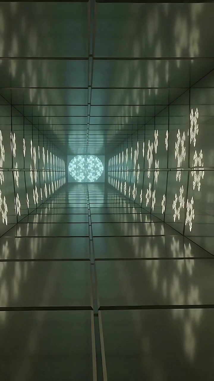 Vertical video: Tilting camera shifting LED motifs in mirror tunnel at gallery with round LED panel