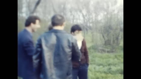 people in soviet union engaged in communication. circa ussr 1980s: a group of people in the soviet union standing around, actively engaged in communication