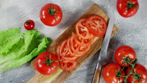 round slices of tomato on the cutting board slowly rotate.