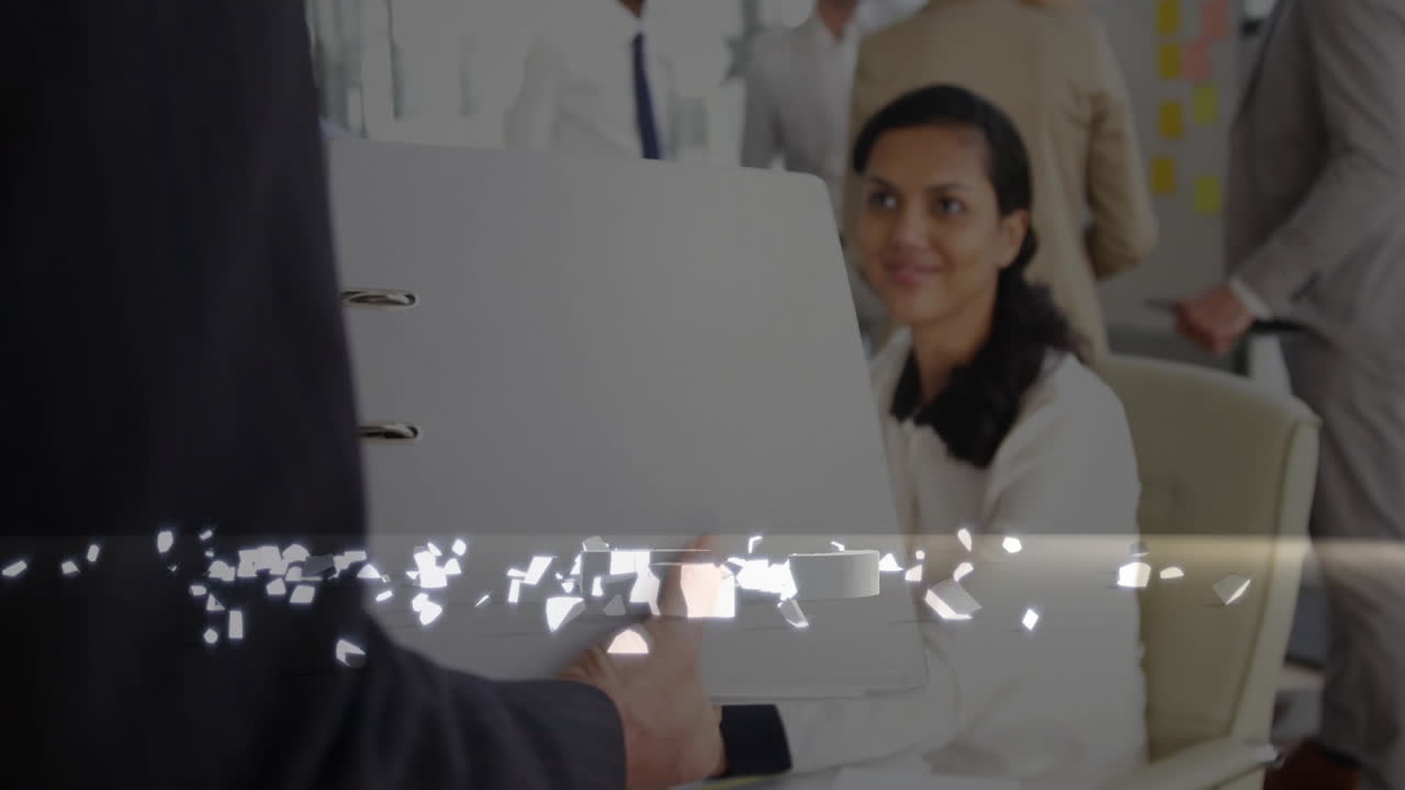 In office, professionals discussing digital data with folder during business meeting