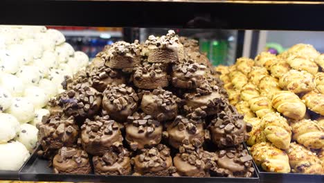 a variety of freshly baked cookies and pastries in a bakery display case