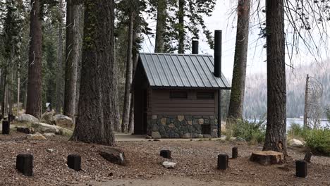 stone outhouse bathroom on a campground by a lake static