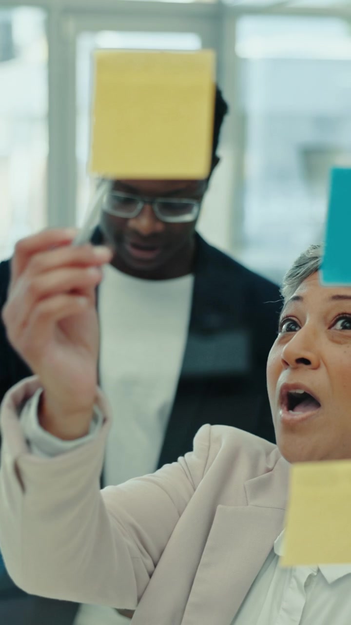 Business Professionals Collaborating on Strategy with Sticky Notes