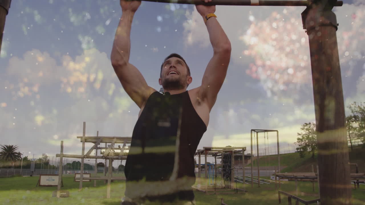 Doing pull-ups outdoors, man with fireworks animation overlay in background