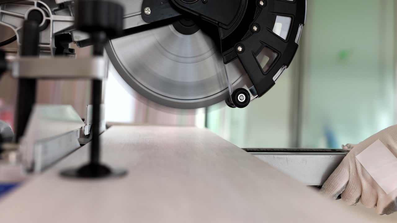 Close-up of a miter saw cutting wood
