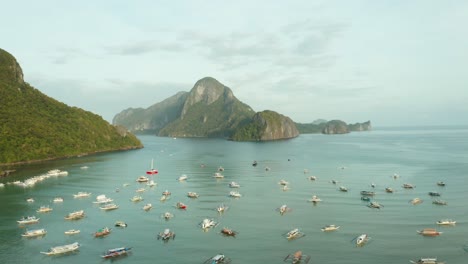 WS-AERIAL-Lots-of-boats-in-harbor-and-sea,-El-Nido,-Palawan,-Philippines