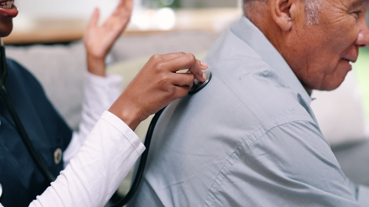 Doctor Examining Patient's Back with Stethoscope