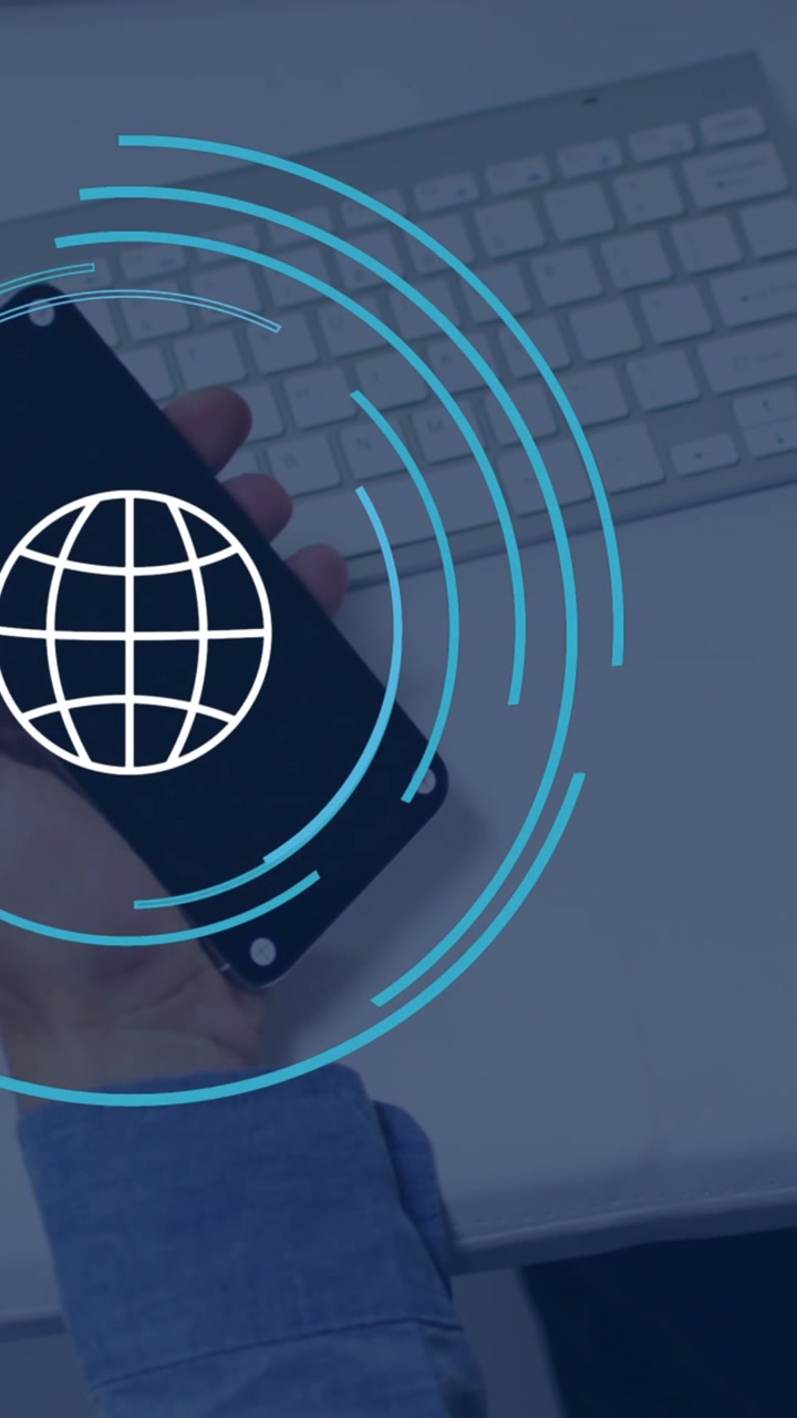 Animation of globe icon over caucasian businessman using smartphone in office