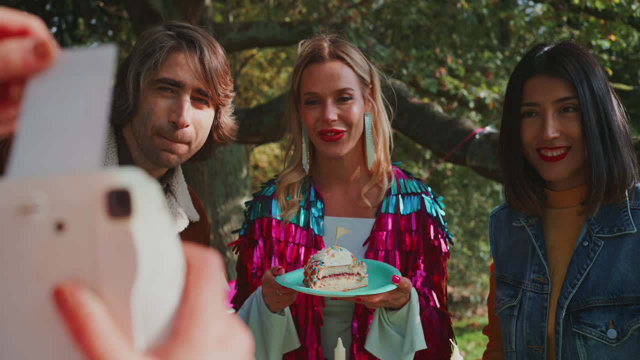 Friends Celebrating a Birthday Outdoors