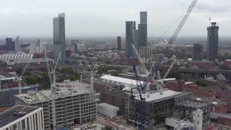 drone shot orbiting construction cranes 06