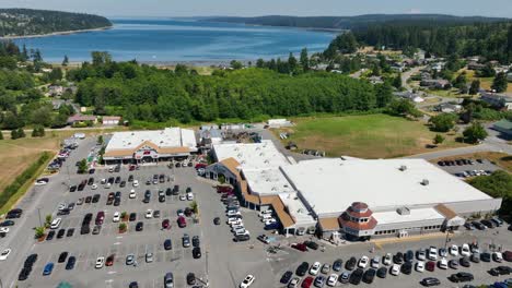 aerial of a shopping outlet in freeland, washington with the pacific ocean off in the distance