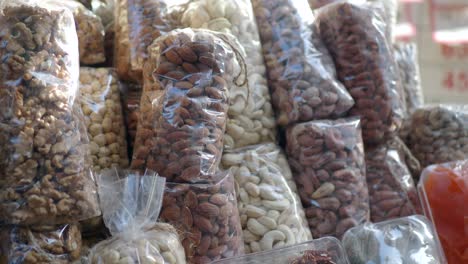 variety of nuts and dried fruits at a market stall