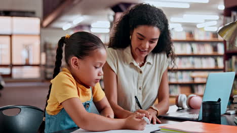 student and teacher working together in library