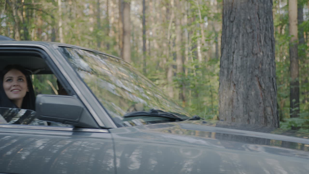 Couple enjoying a road trip through the forest