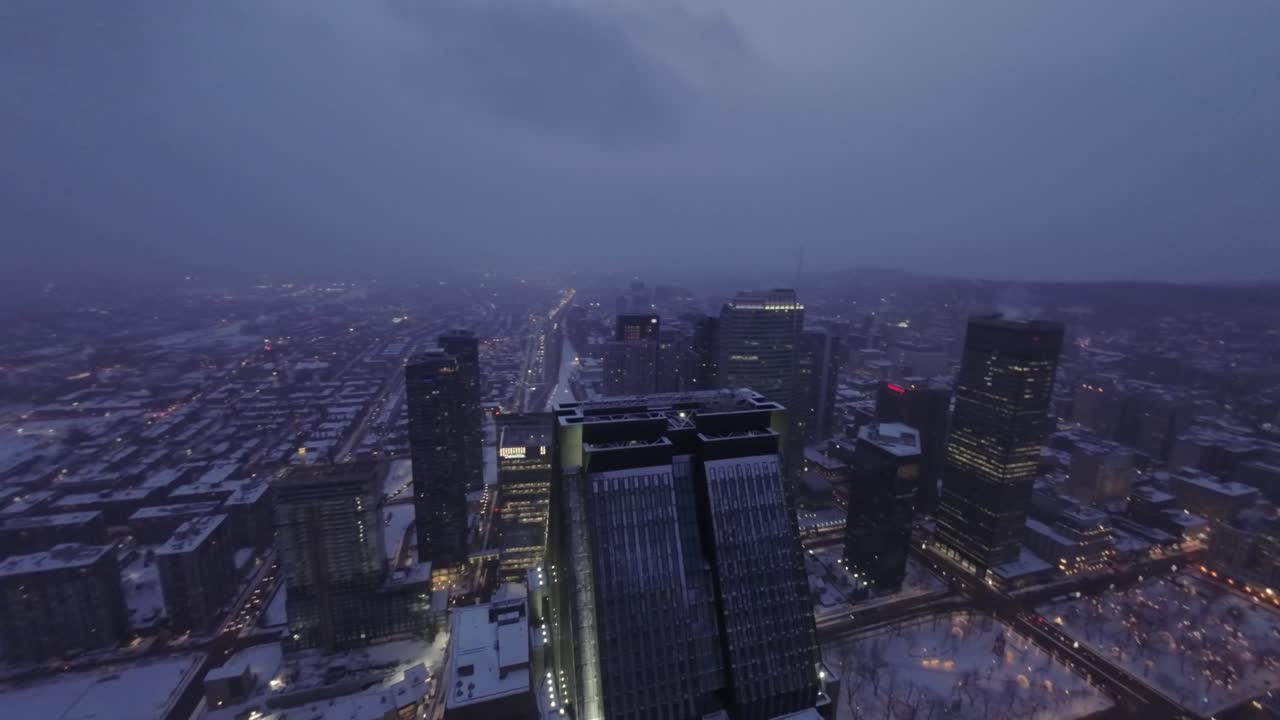Winter Panorama of Montreal from an FPV Drone, Dynamic Shot of a Skyscraper Against the City.