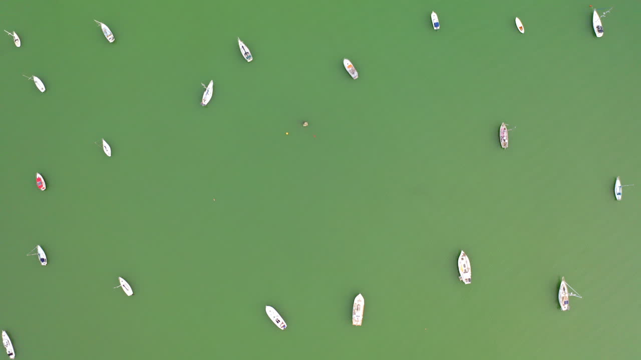 Aerial View of Numerous Boats on Green Water
