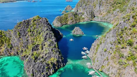 Drone-footage-over-a-lagoon-with-boats-on-Coron-island-in-the-Philippines