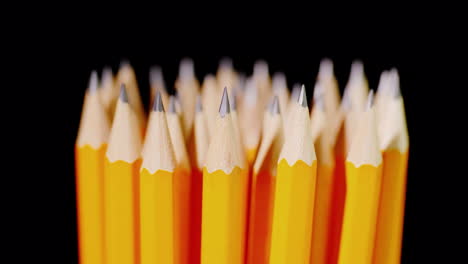 A-Set-Of-Multi-Colored-Pencils-On-A-Black-Background