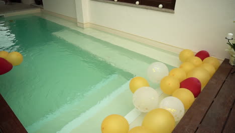 ballons floating in a swimming pool