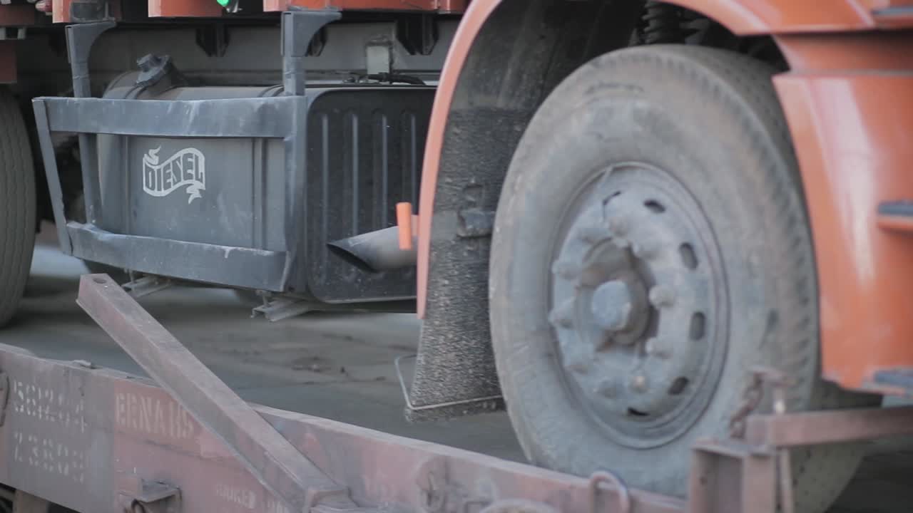 indian train carring truck on weel closeup