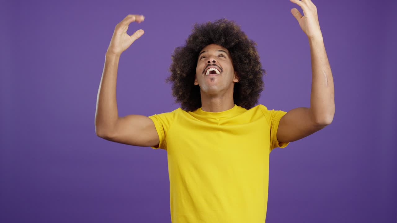 Man with afro hair displaying various emotions and gestures