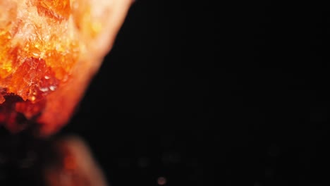 Cinematic-luminous-shot-of-golden-citrine-quartz-crystal-aglow-against-dark-background