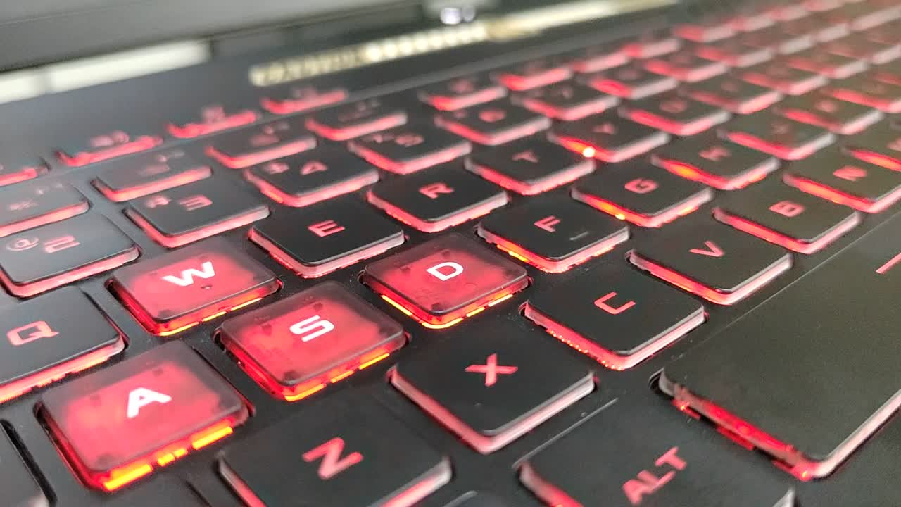 Red backlit gaming laptop keyboard. Perfect for high-performance gaming setups and intense sessions.